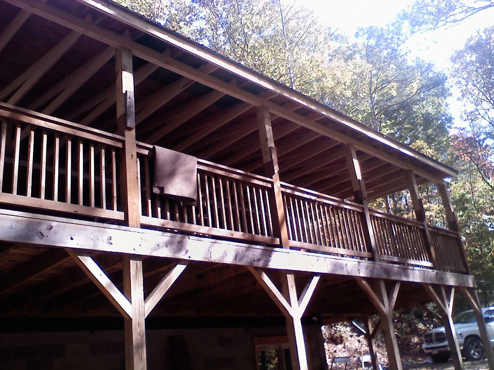 Timber framing under a new elevated porch and deck — Roof Leak Repair in Shawano by Roofing Brothers